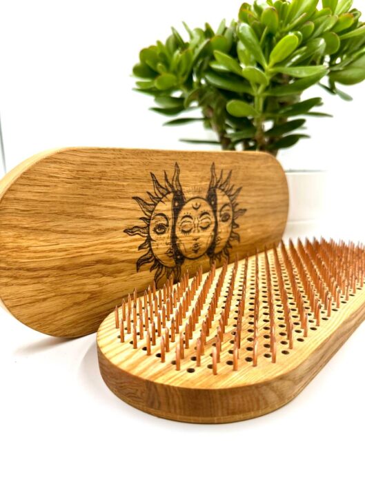 Sadhu board. Copper nail. Sun and moon foto